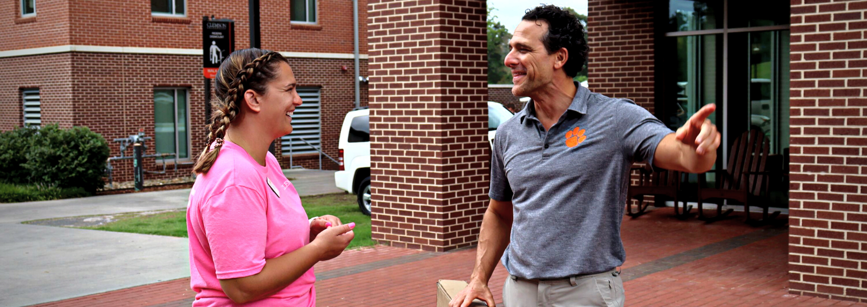 Community Director talking with parent at move-in