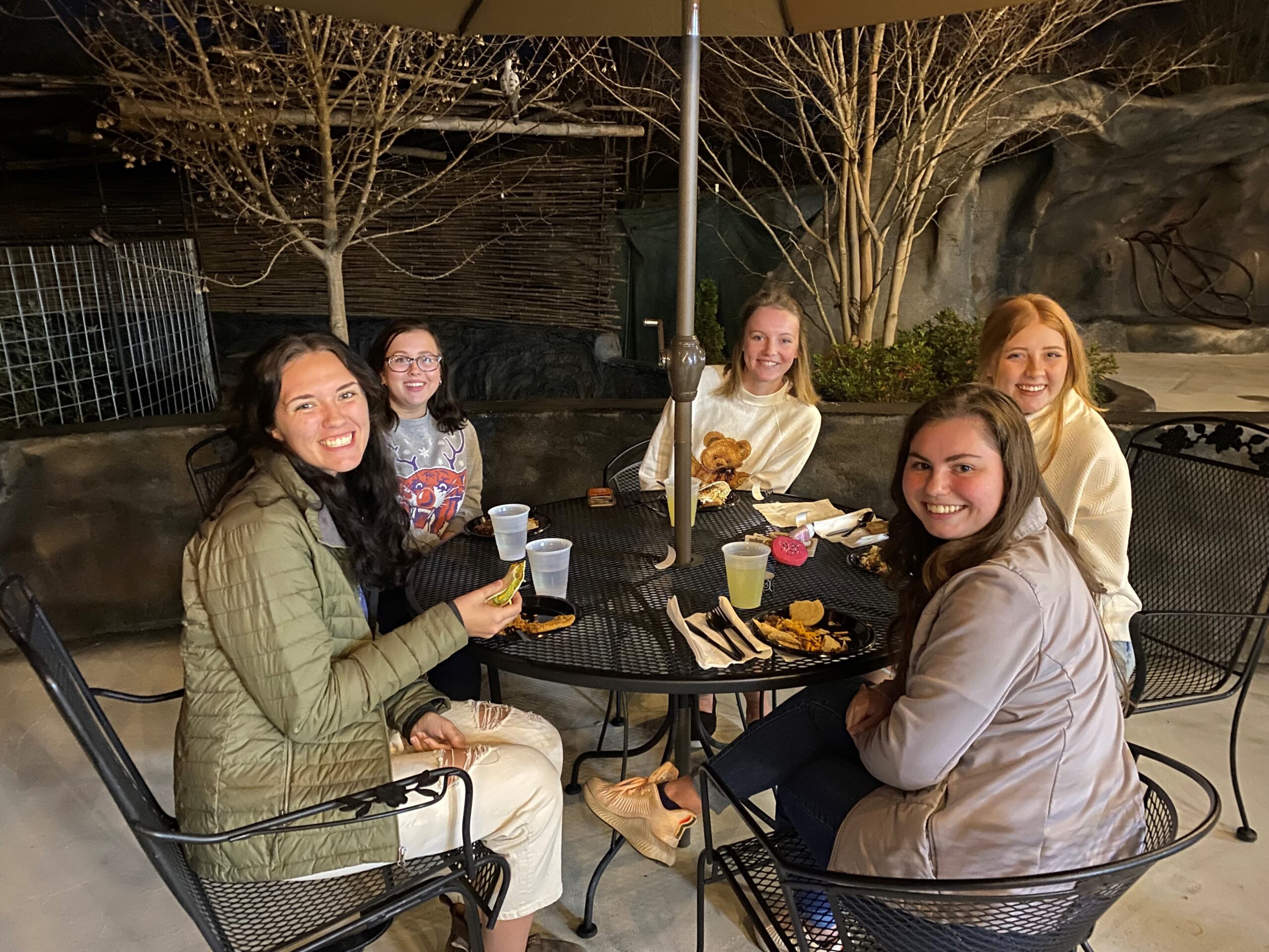 Teaching Fellows residents eating together at a table outside