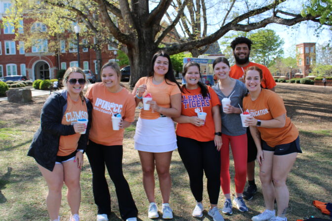 Teaching Fellows residents posing with snowcones